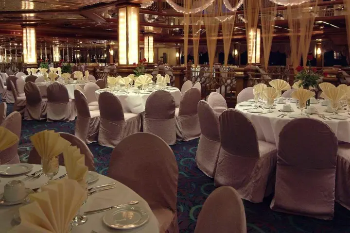 a group of people sitting at a table with wine glasses